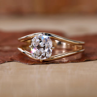Cushion old mine cut ring with yellow gold diamond ring.
