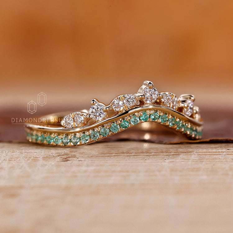 Tiara style wedding band with prong setting details.