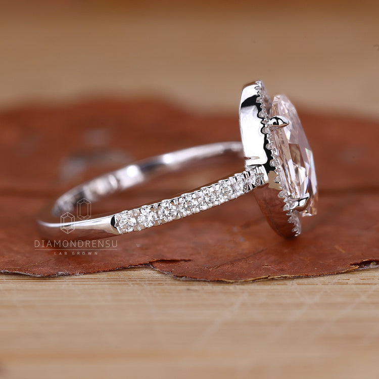 Halo engagement ring set in 4 claw prong setting.

