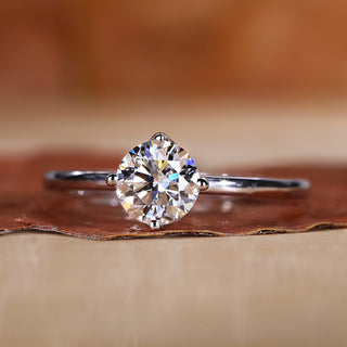 Solitaire engagement ring with a clean and minimal design.
