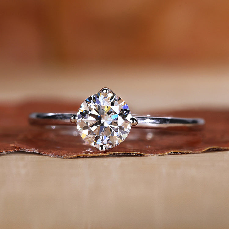 Solitaire engagement ring with a clean and minimal design.
