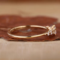 yellow gold engagement ring with five stone setting.
