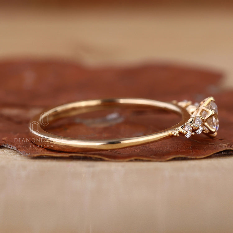 yellow gold engagement ring with five stone setting.
