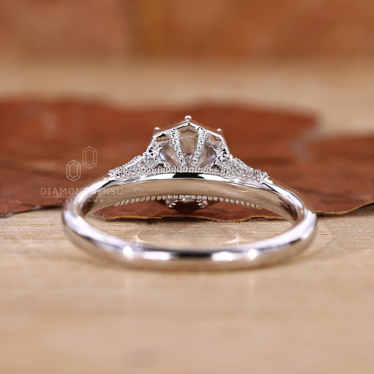 round prong ring with white gold engagement ring.
