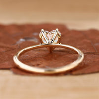 Yellow gold diamond ring with heart shaped centre.

