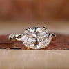 East West engagement ring with oval diamond.
