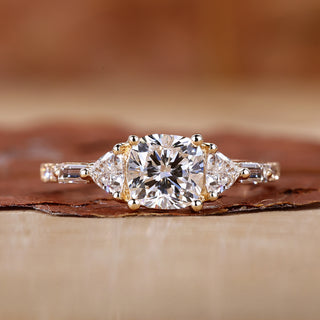 Cushion cut diamond ring with 3 stone engagement ring.
