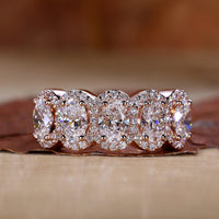 oval engagement ring in rose gold band.
