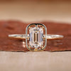 Emerald cut engagement ring with solitaire engagement ring.

