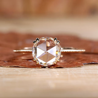 Solitaire engagement ring with a round rose cut ring.

