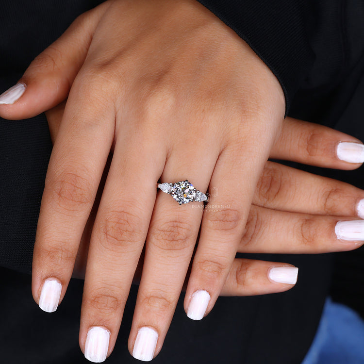 Handmade ring showing craftsmanship with unique 3 stone setting on gold.
