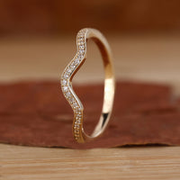 Stackable eternity band with wave eternity band.
