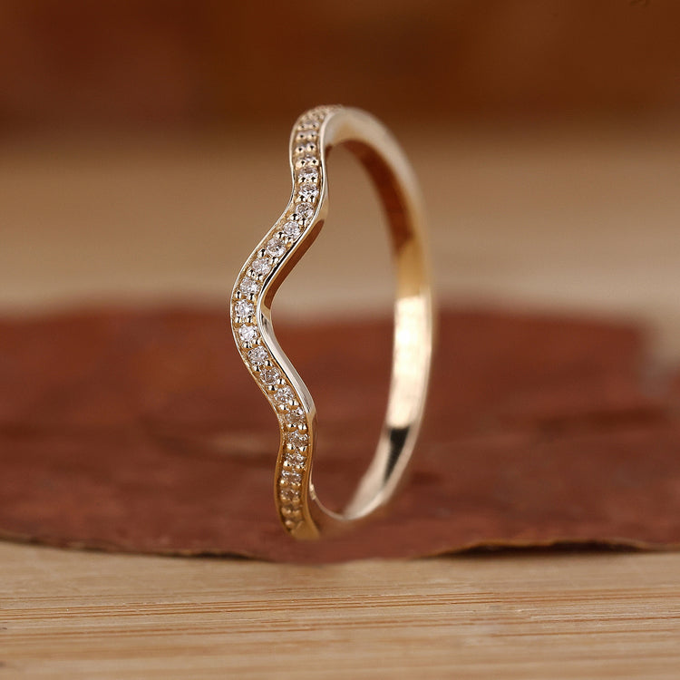 Stackable eternity band with wave eternity band.
