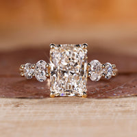 Radiant diamond engagement ring with 5 stone engagement ring.
