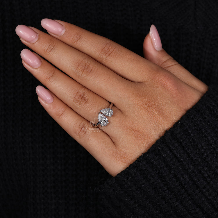 IGI certified two stone ring with pear diamonds in white gold.
