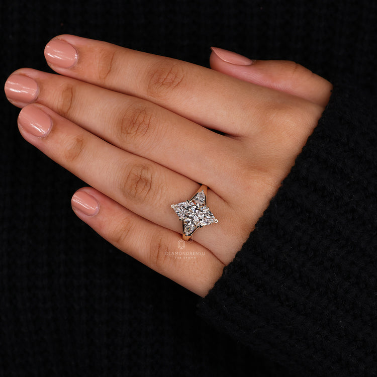 Customise ring with pear side stone style.

