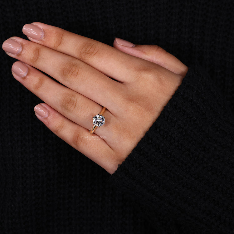 Lab grown diamond solitaire ring in a yellow gold handmade design.
