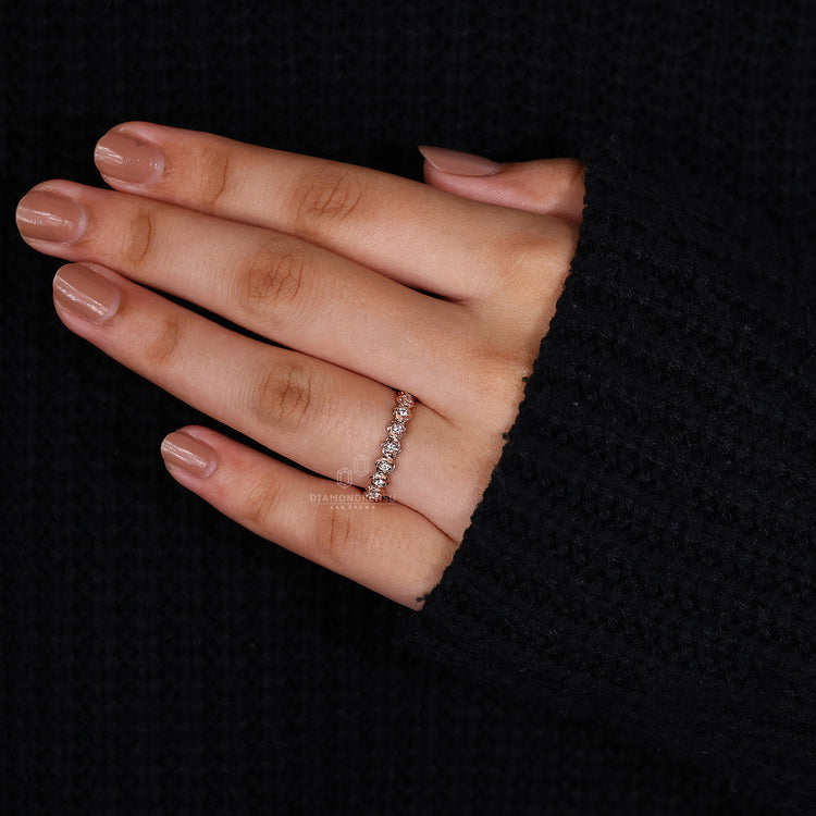 Rose gold wedding band and handmade jewelry together.
