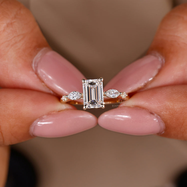 Buy Engagement ring with marquise and round side stone.
