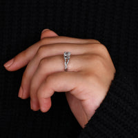White gold engagement ring with nature inspired detailing.
