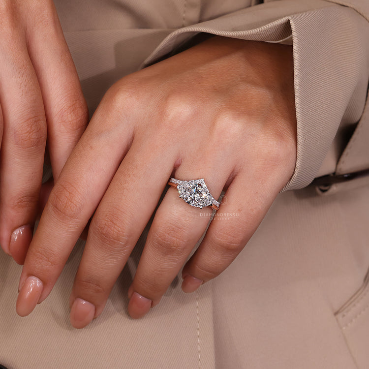 Lab grown diamond ring with V shaped setting in rose and white gold.
