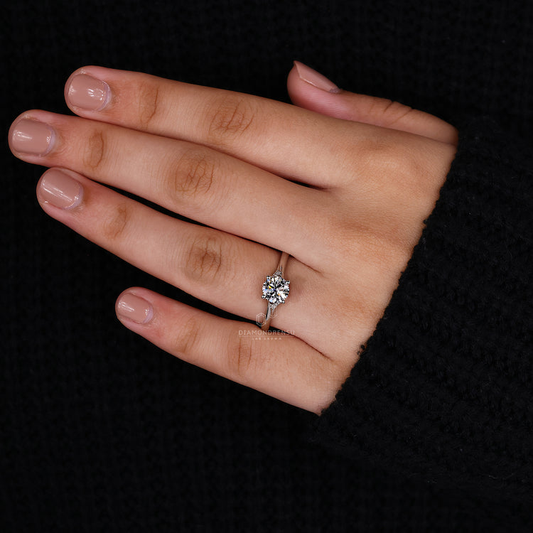 Round cut side stone ring in a trellis setting for added detail.
