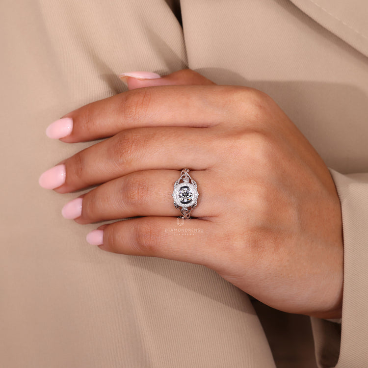 Lab grown round diamond ring in bezel and milgrain setting.
