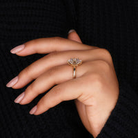 Yellow gold ring with a hexagon shape and solitaire centre diamond.
