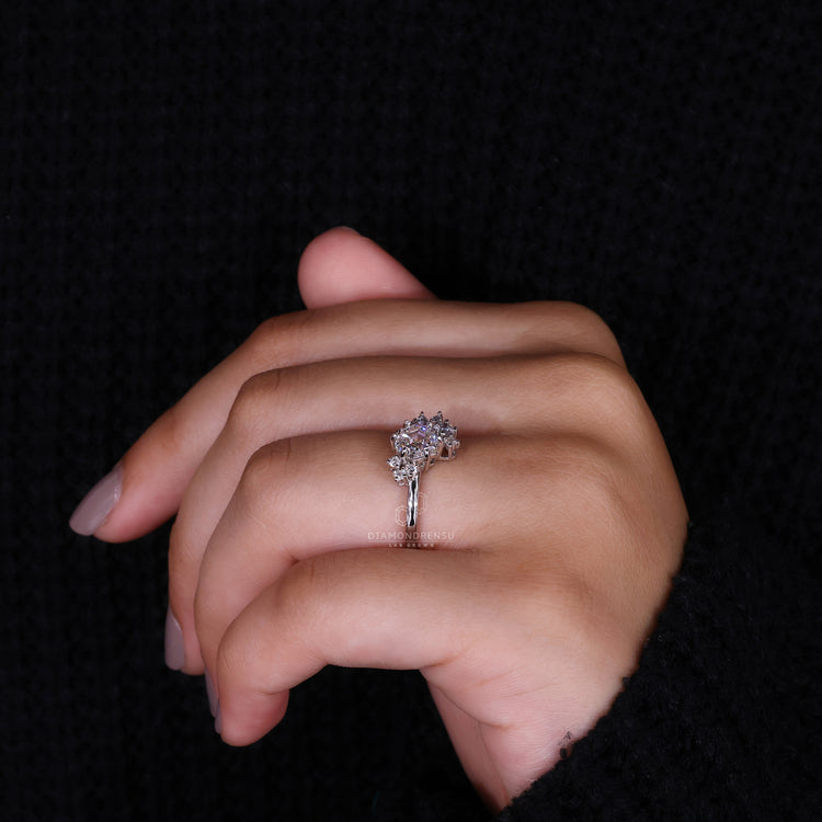 marquise round side stone on cluster engagement ring.
