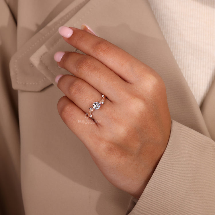 IGI certified rose gold ring with round diamond and side stones.
