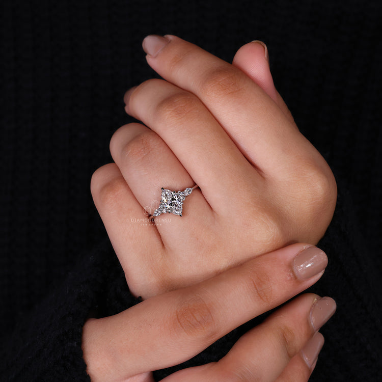 white gold diamond ring with marquise side stones.
