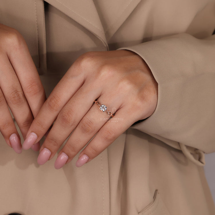 Customise ring with round diamond and four heart prong in rose gold.
