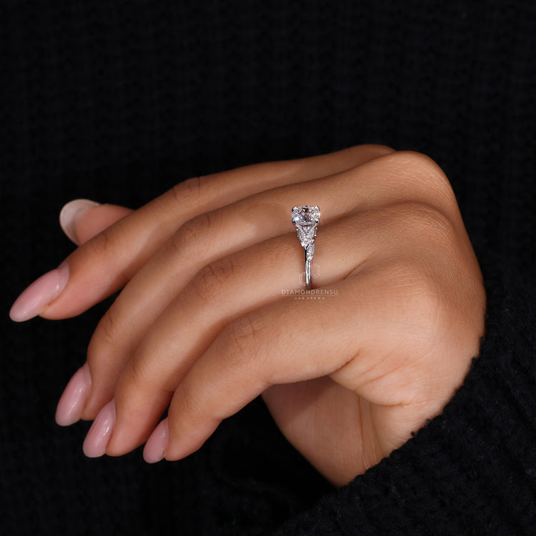 Customise ring with Portuguese cut diamond and round side accents.
