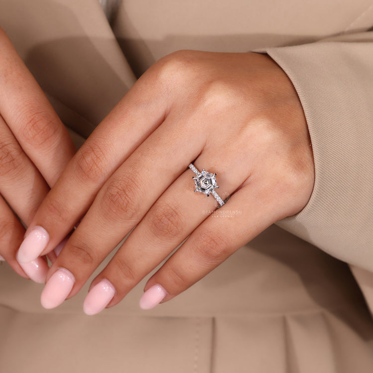 Lab grown diamond pavé ring with hexagon cut and halo design.
