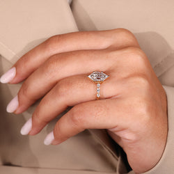 Yellow Gold Ring with Dutch marquise and round side stones.
