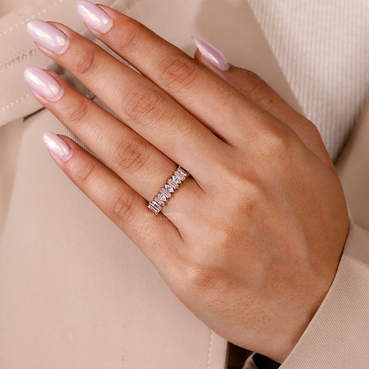 Prong set diamond band with marquise cuts.
