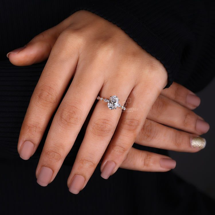 Oval center stone engagement ring in rose gold.
