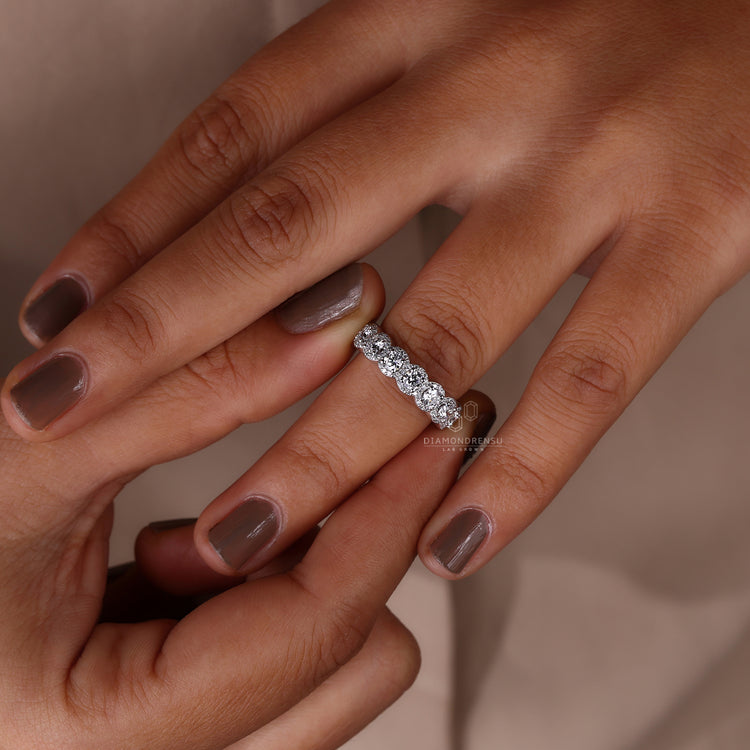 Halo wedding band with prong setting.