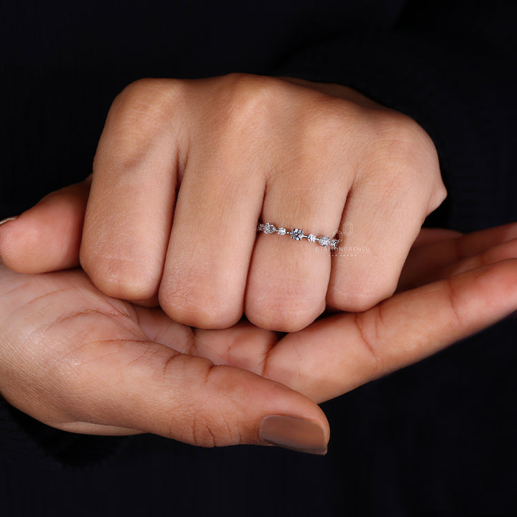 White gold wedding band with prong setting band.
