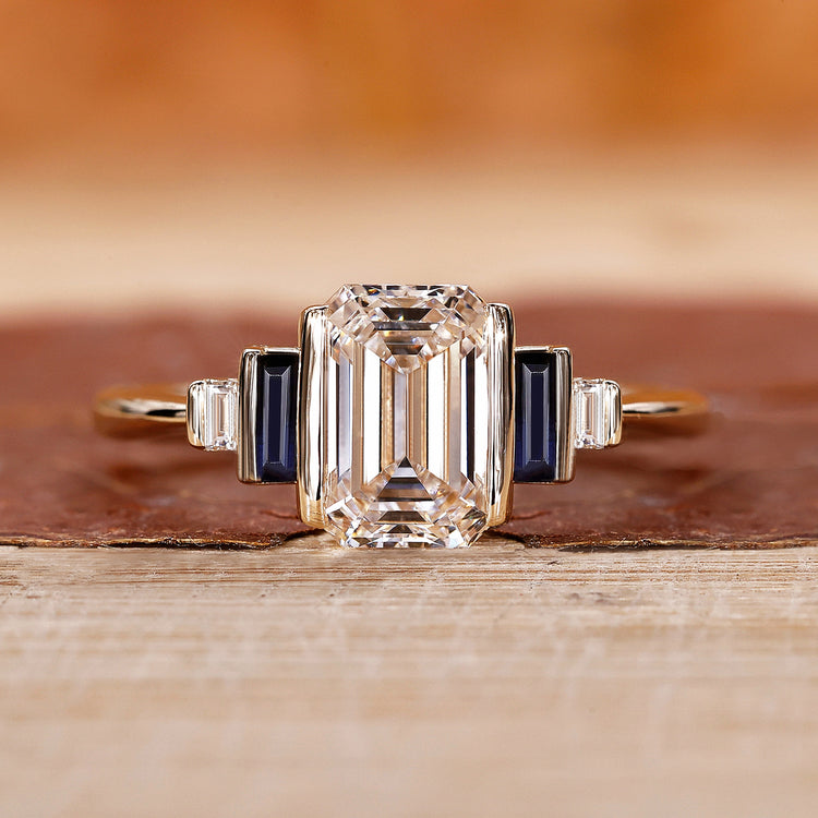 5 stone ring with emerald cut diamond and baguette side stones.
