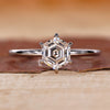 Hexagon step cut diamond ring in white gold diamond ring.
