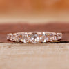 Round rose cut wedding band with shared prong setting.