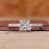 Princess cut diamond ring with 4 claw prong.
