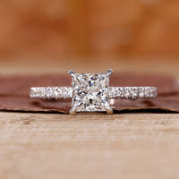 Princess cut diamond ring with 4 claw prong.
