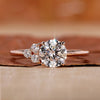 asymmetrical engagement ring with round cut side stone.
