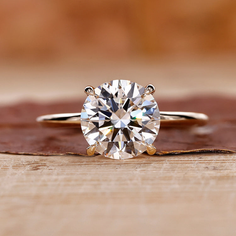 Round Diamond Engagement Ring with yellow gold setting.
