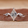 3 stone diamond engagement ring with kite side stones.
