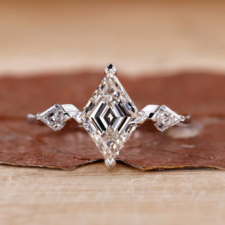 3 stone diamond engagement ring with kite side stones.
