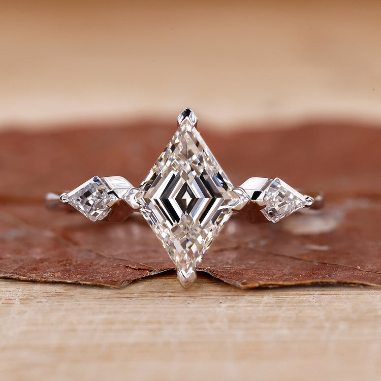 3 stone diamond engagement ring with kite side stones.

