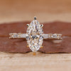 Marquise diamond engagement ring with pave setting ring.
